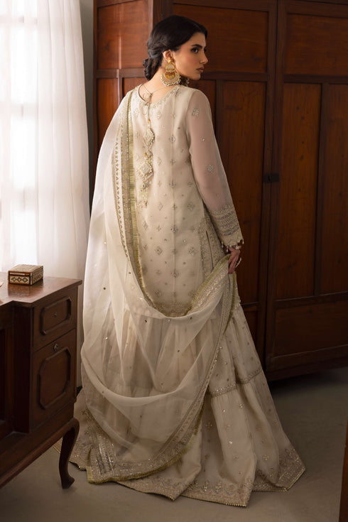 Rear of NAQSHI Jeena shirt highlighting chunky handmade tassels at back, repeated floral embroidery motifs and neat cutline.